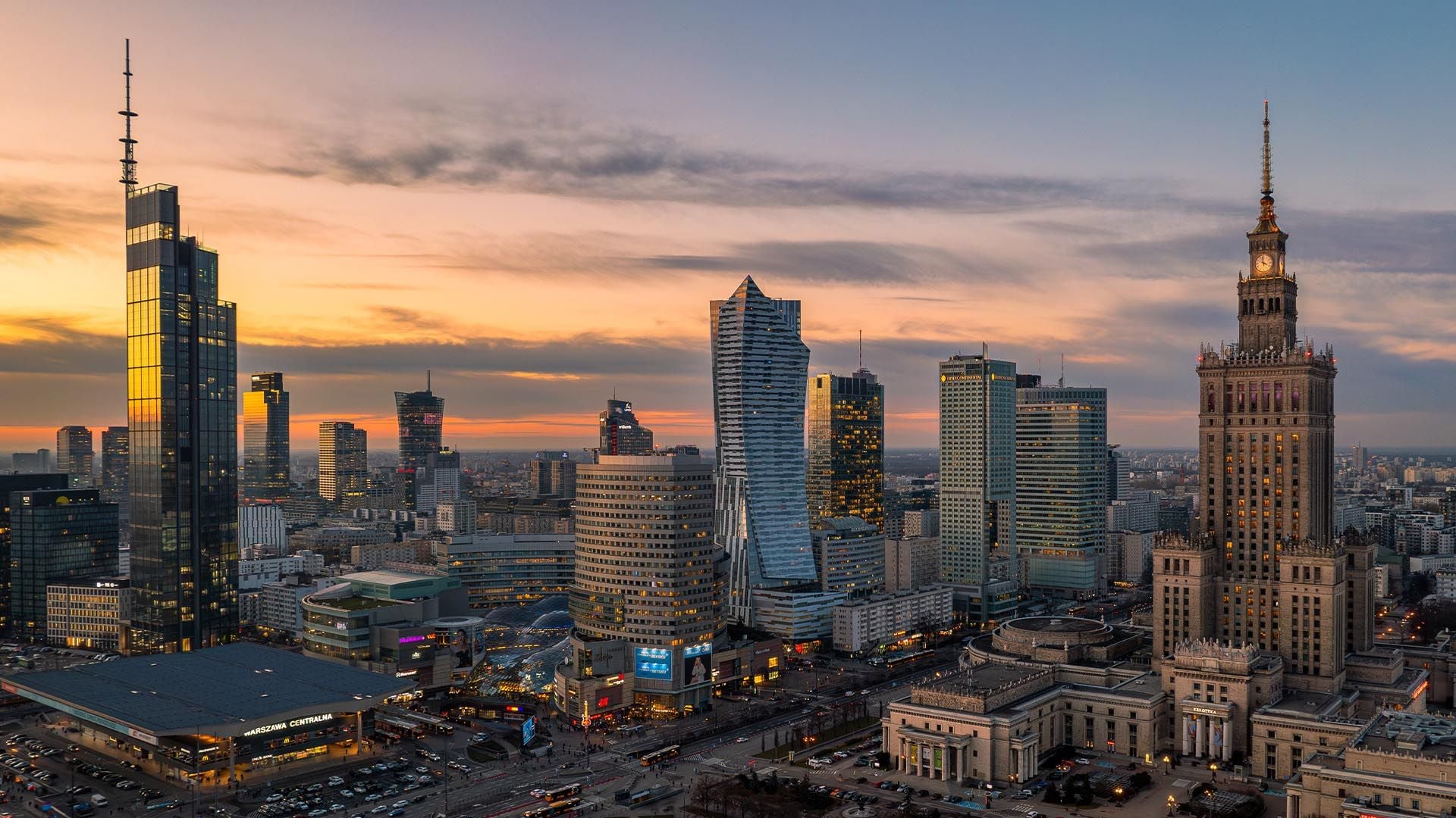 View of modern office buildings in Warsaw, Poland, at dusk