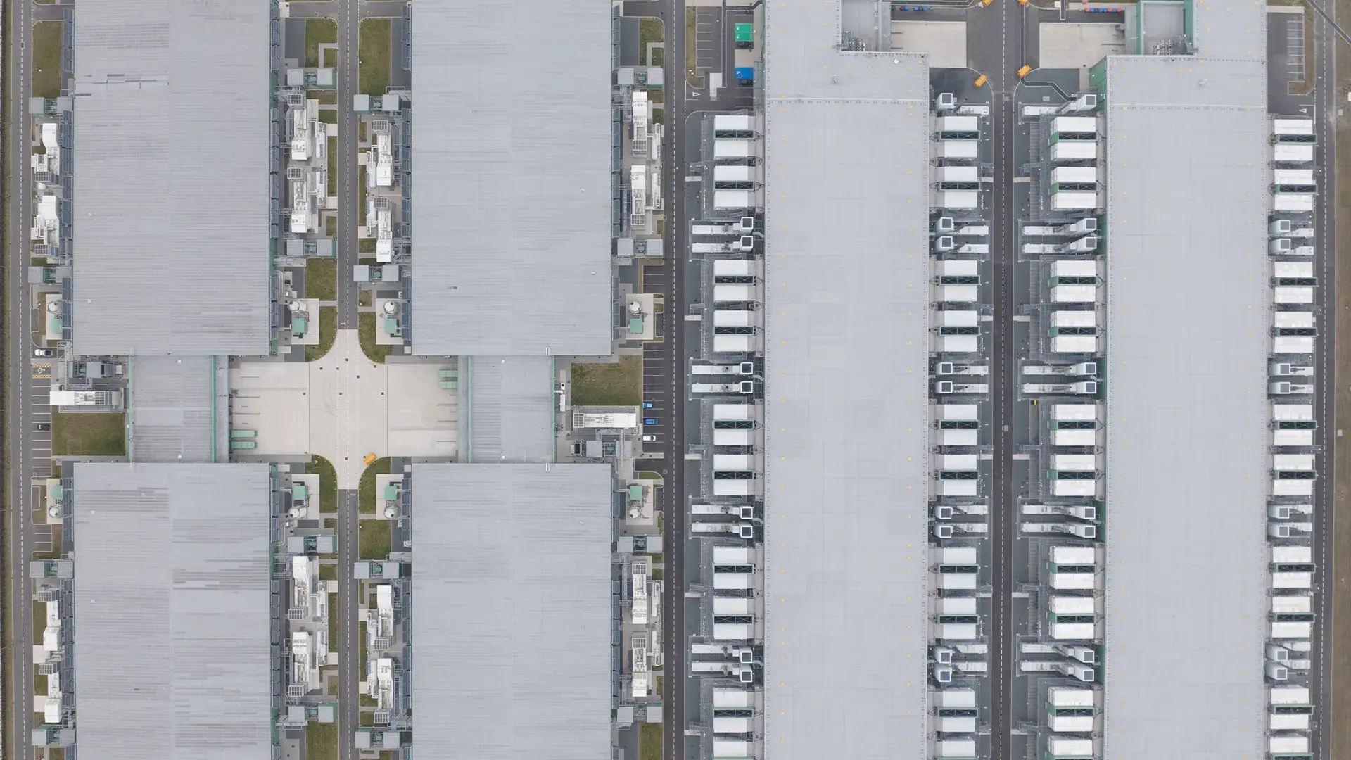 Aerial view of a massive hyperscale campus featuring multiple large data centres, a significant piece of commercial real estate infrastructure, likely situated in a major hub in Europe.