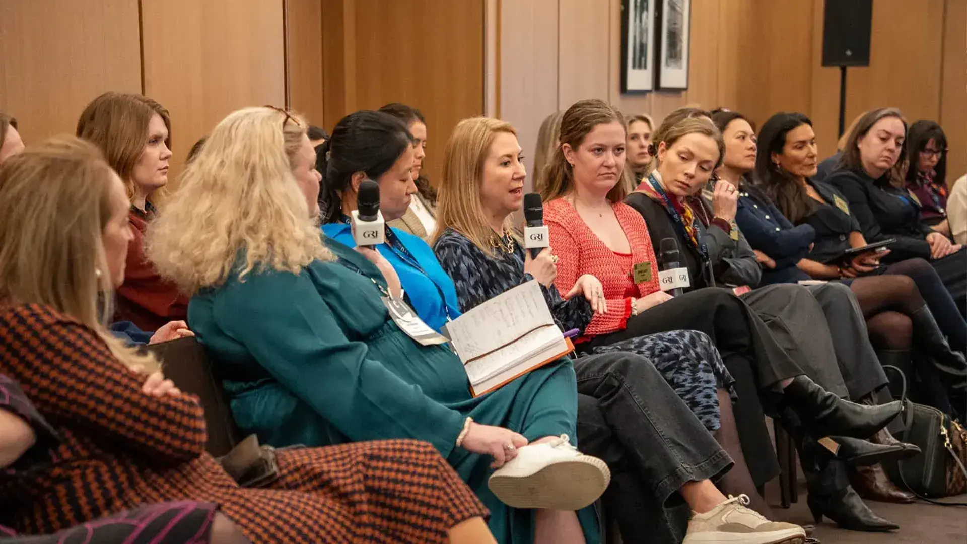 Female real estate executives engaging in a panel discussion and sharing insights during a GRI Institute forum.