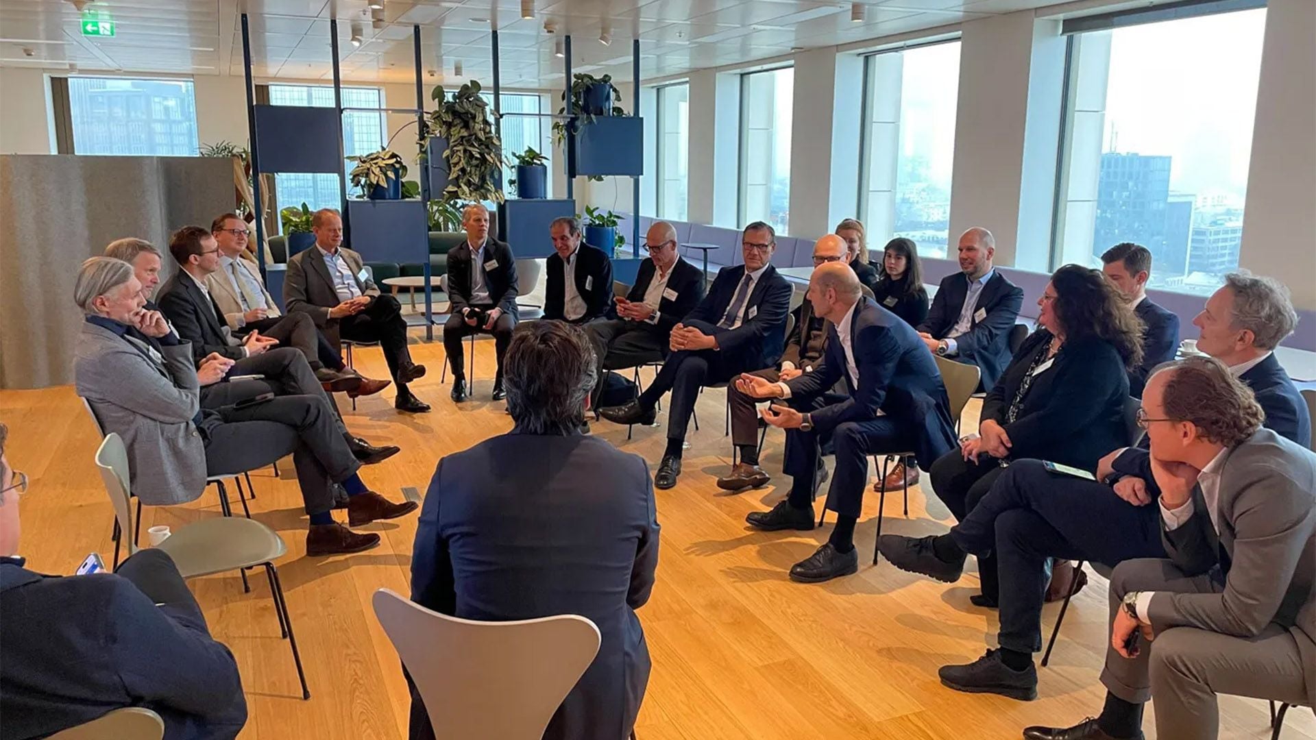 German real estate leaders discussing the results of the GRI Chairmen's Retreat survey results in Ardian's modern office space