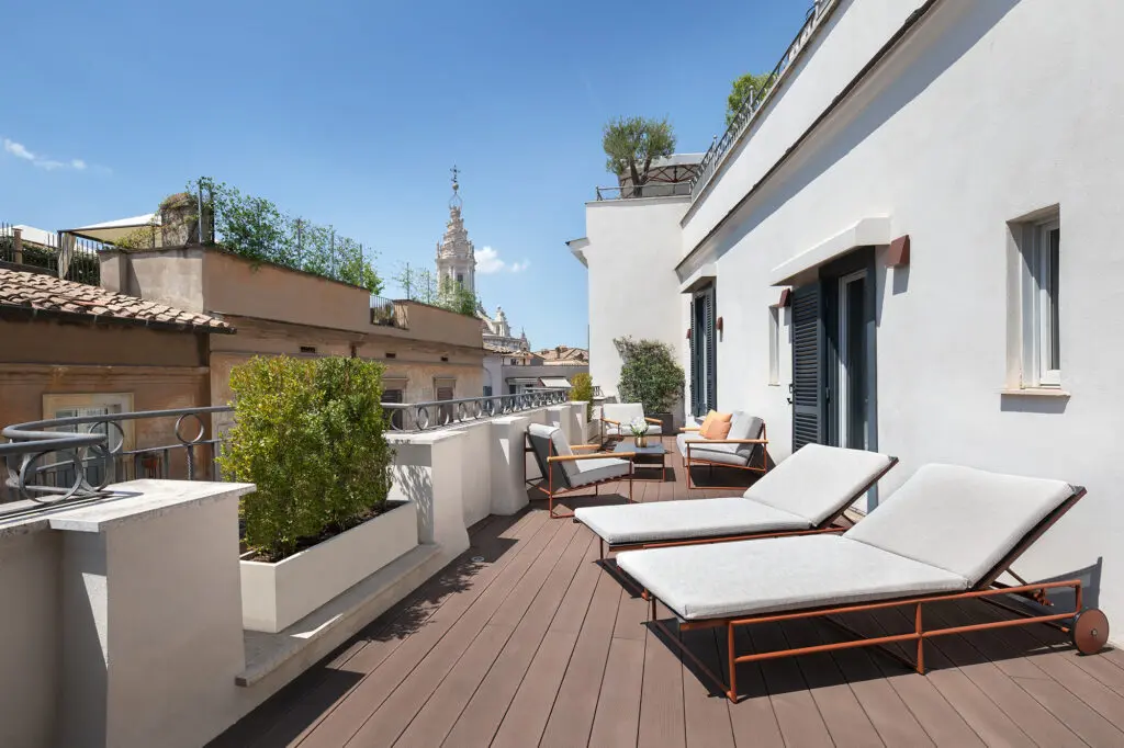 A private terrace attached to a Junior Suite at AK ROMPA, furnished with comfortable outdoor seating, offering a relaxing outdoor space.