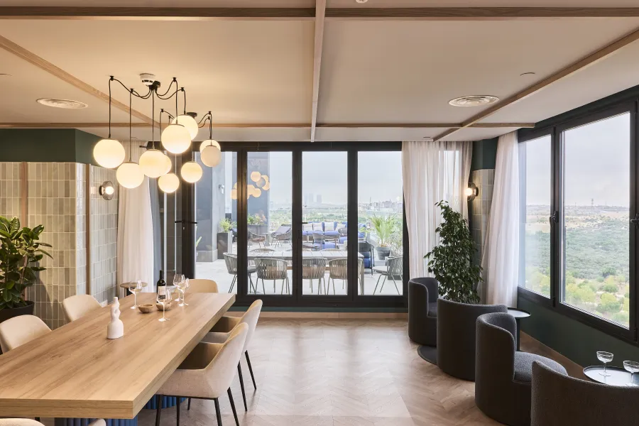 A luxurious guest room in the Orient Express La Minerva, featuring a plush bed with rich textiles and classic decor.