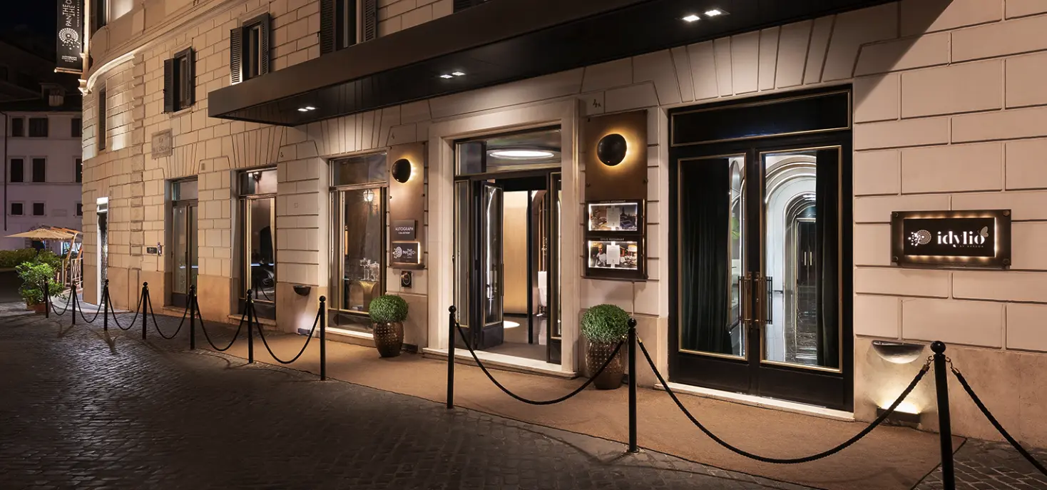 Exterior view of the AK ROMPA hotel building, showing its architectural style and facade.