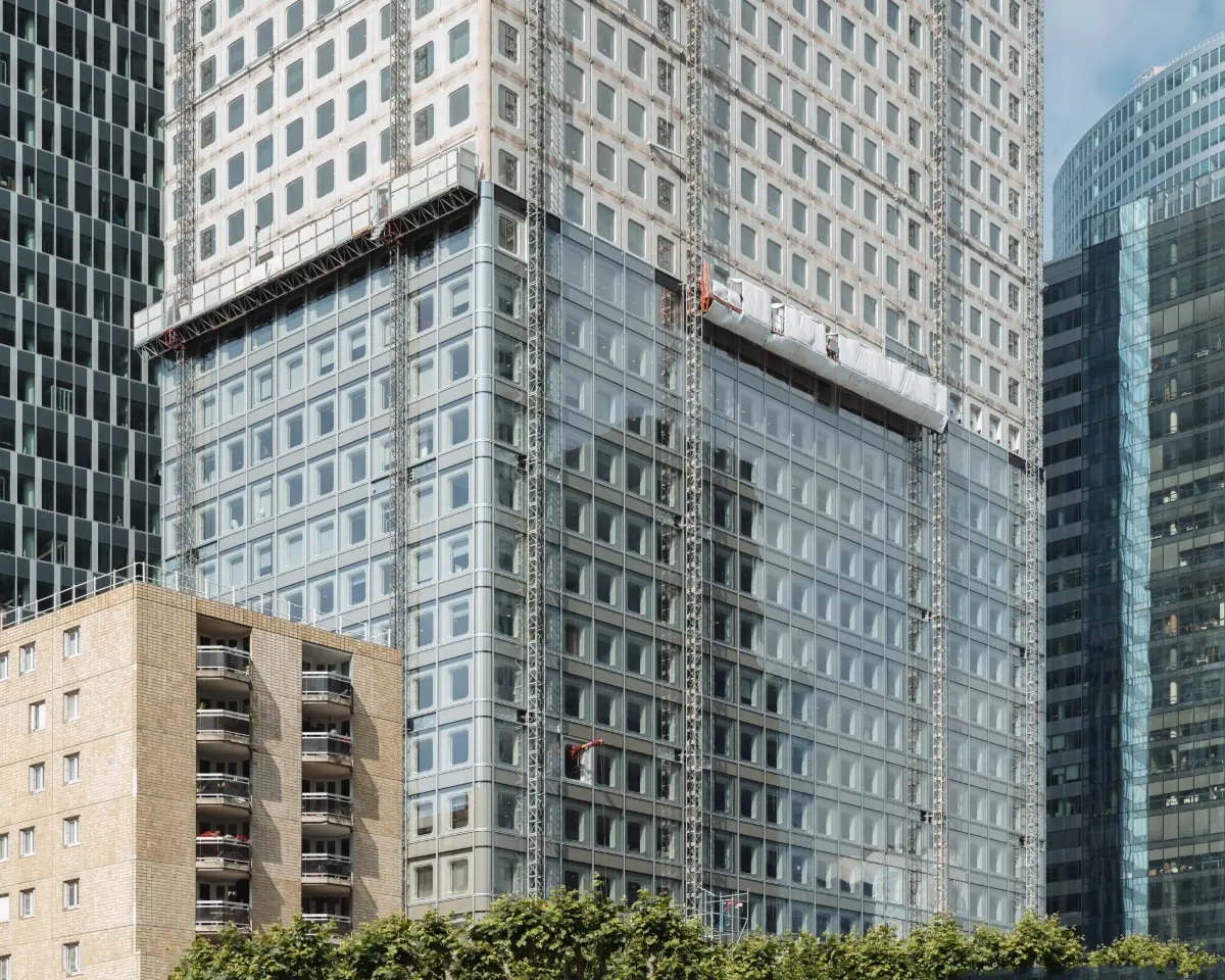 Exterior perspective of Tour Ariane showing its modern office facade in an urban context
