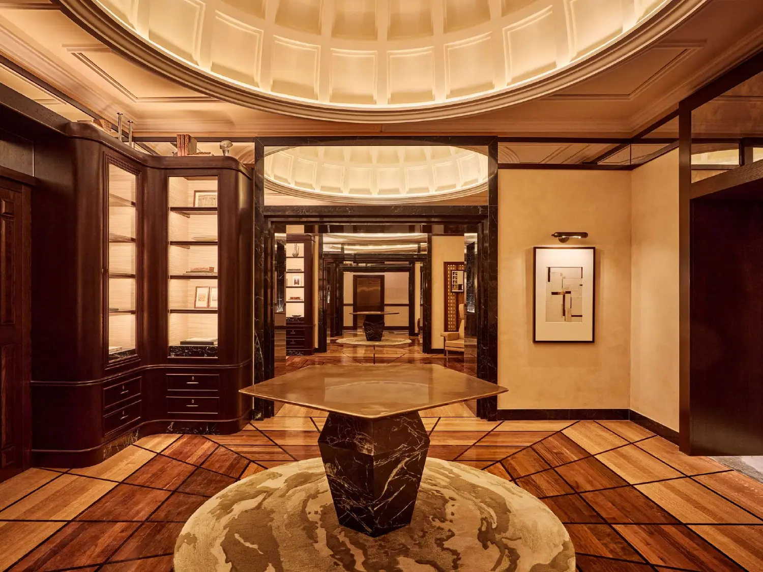 An elegant seating nook in the hotel, with velvet armchairs, a marble table, and dramatic drapery, creating an intimate and luxurious atmosphere.