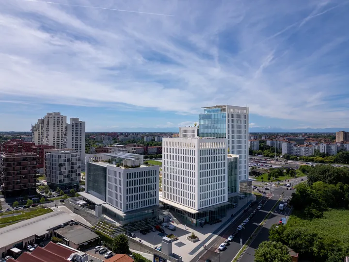 An elegant seating nook in the hotel, with velvet armchairs, a marble table, and dramatic drapery, creating an intimate and luxurious atmosphere.