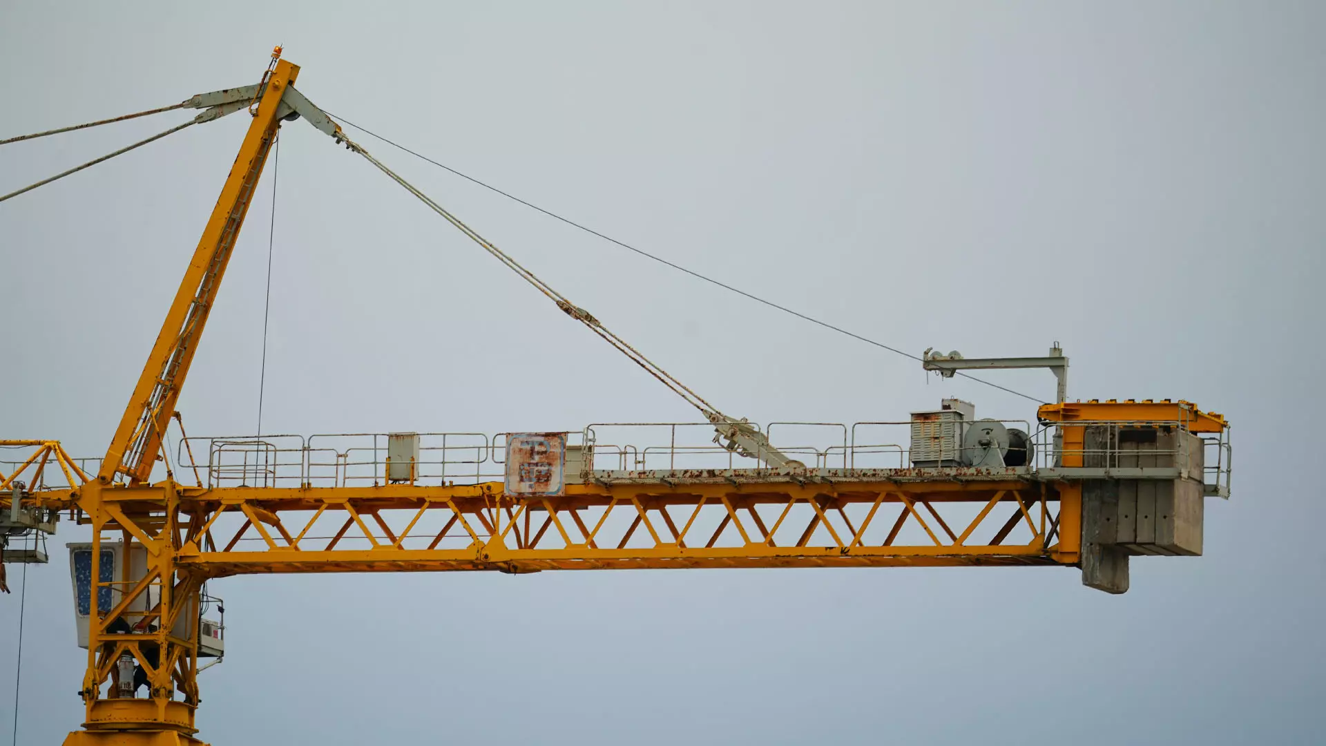 Construction crane against the blue sky